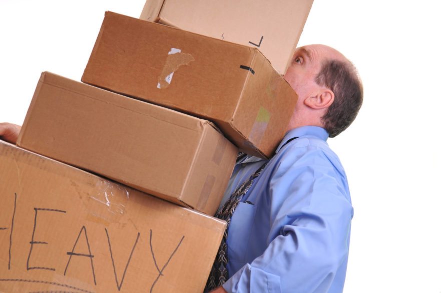Man carrying boxes - how to help your spouse when they need it