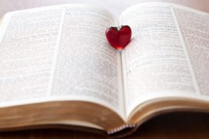 A small heart sitting in a Bible - spiritual growth as a married couple