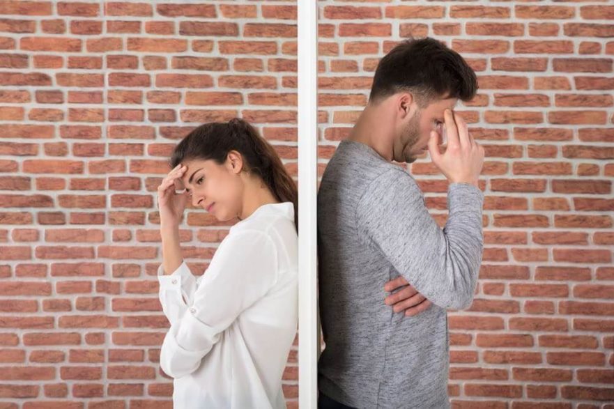Couple separated by wall - criticism