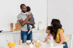 Young African American family - keeping love alive while parenting